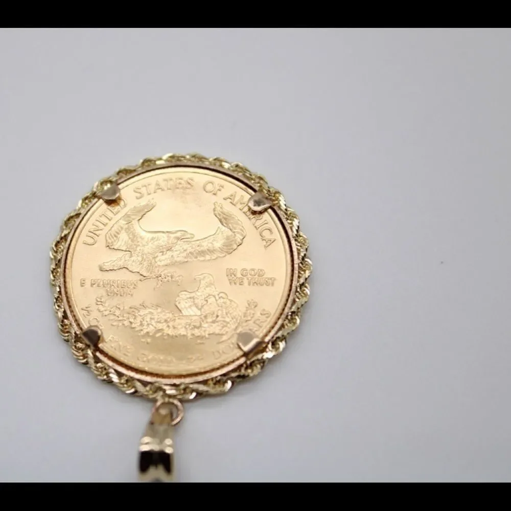 New 22k gold American Eagle 1/2 ounce coin mounted in 14k gold coin bezel